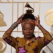 Angelique Kidjo poses with her Best World Music Album trophy for "Sings" in the press room during the 58th Annual Grammy Music Awards in Los Angeles on February 15, 2016.  AFP PHOTO / MARK RALSTON