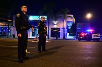 Police stand guard at the scene near the intersection of Garvey and Garfield Avenue in Monterey Park, California, on January 22, 2023, where police are responding to reports of multiple people shot. - Police were at the scene of a shooting in southern California that has caused a number of casualties, the Los Angeles Times reported January 22, citing a law enforcement source. (Photo by Frederic J. BROWN / AFP)