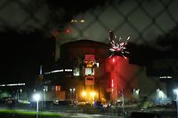TOPSHOT - This handout photograph taken and released by Greenpeace early October 12, 2017, shows a firework exploding at the Cattenom Nuclear Power Plant, some 50kms north of Metz. 
Greenpeace environmental activists were arrested after briefly entering the Cattenom nuclear power plant in Lorraine (eastern France) to alert the vulnerability of these sites to a possible attack. "Greenpeace activists on site, stopped by the gendarmes, no access to the nuclear zone, no impact on the safety of the installations", according to the twitter account of the power station, located a few kilometers from the border of Luxembourg. / AFP PHOTO / Greenpeace / HO /    IMAGE AVAILABLE FOR DOWNLOAD BY EXTERNAL MEDIA FOR 10 DAYS AFTER RELEASE -- RESTRICTED TO EDITORIAL USE - MANDATORY CREDIT "AFP PHOTO / GREENPEACE " - NO MARKETING NO ADVERTISING CAMPAIGNS - DISTRIBUTED AS A SERVICE TO CLIENTS --  NO ARCHIVE --

