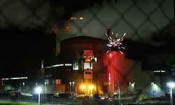 TOPSHOT - This handout photograph taken and released by Greenpeace early October 12, 2017, shows a firework exploding at the Cattenom Nuclear Power Plant, some 50kms north of Metz. 
Greenpeace environmental activists were arrested after briefly entering the Cattenom nuclear power plant in Lorraine (eastern France) to alert the vulnerability of these sites to a possible attack. "Greenpeace activists on site, stopped by the gendarmes, no access to the nuclear zone, no impact on the safety of the installations", according to the twitter account of the power station, located a few kilometers from the border of Luxembourg. / AFP PHOTO / Greenpeace / HO /    IMAGE AVAILABLE FOR DOWNLOAD BY EXTERNAL MEDIA FOR 10 DAYS AFTER RELEASE -- RESTRICTED TO EDITORIAL USE - MANDATORY CREDIT "AFP PHOTO / GREENPEACE " - NO MARKETING NO ADVERTISING CAMPAIGNS - DISTRIBUTED AS A SERVICE TO CLIENTS --  NO ARCHIVE --

