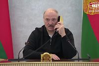 This grab taken from a video released by Belarus state agency "Belta" shows President Alexander Lukashenko working at the crises center, which is not located at his residence during protests on August 23, 2020, in Minsk. - Tens of thousands of demonstrators massed in central Minsk on Sunday to demand the resignation of Belarusian President Alexander Lukashenko, who flew over the scene of the banned protest in a helicopter and called the marchers "rats". (Photo by - / BELTA / AFP)