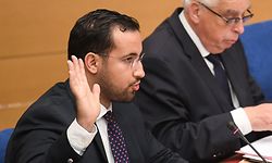 (FILES) In this file photo taken on September 19, 2018 Former Elysee senior security officer Alexandre Benalla raises his hand as he takes the oath before a Senate committee in Paris. - Benalla has been placed under police custody, suspected of "forgery and falsification" in the case of his diplomatic passports, AFP reported on January 17, 2019. (Photo by Alain JOCARD / AFP)