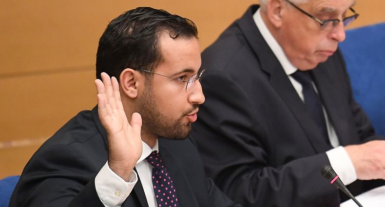 (FILES) In this file photo taken on September 19, 2018 Former Elysee senior security officer Alexandre Benalla raises his hand as he takes the oath before a Senate committee in Paris. - Benalla has been placed under police custody, suspected of "forgery and falsification" in the case of his diplomatic passports, AFP reported on January 17, 2019. (Photo by Alain JOCARD / AFP)