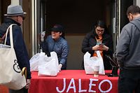 WASHINGTON, DC - MARCH 17: People purchase carry-out lunches out of the back door of celebrated Chef Jos� Andres' Jaleo restaurant in response to the novel coronavirus March 17, 2020 in Washington, DC. Andres, whose World Central Kitchen has set up disaster response kitchens to feed people in Puerto Rico, Indonesia, Mozambique, Guatemala and other countries, converted all his Washington restaurants into 'community kitchens' in response to the COVID-19 outbreak.   Chip Somodevilla/Getty Images/AFP
== FOR NEWSPAPERS, INTERNET, TELCOS & TELEVISION USE ONLY ==