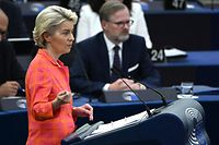 European Commission President Ursula Von der Leyen (L) delivers a speech, as Czech Prime Minister Petr Fiala (C, background) looks on, at the European Parliament in Strasbourg, eastern France, on July 6, 2022. - The Czech Republic takes over the Presidency of the Council of European Union. (Photo by PATRICK HERTZOG / AFP)
