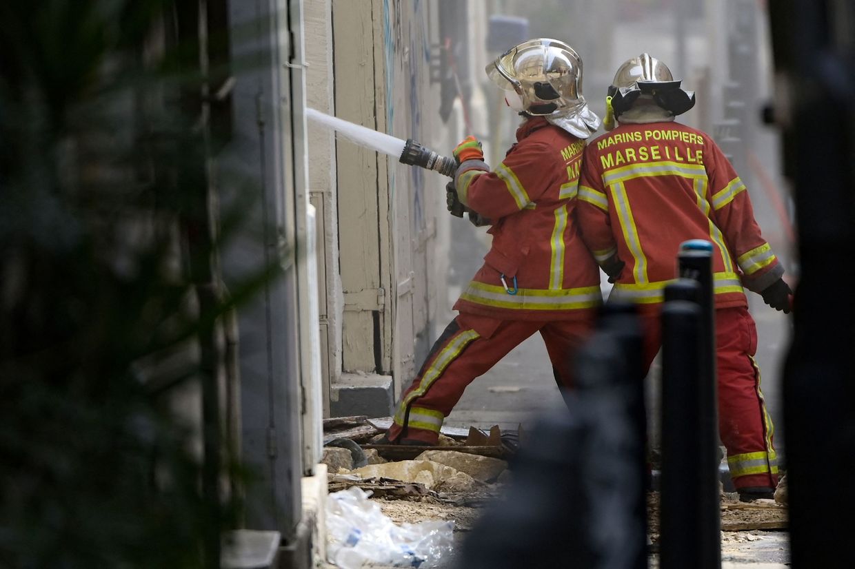 Firefighters tackle a blaze on Rue Tivoli in Marseille. 