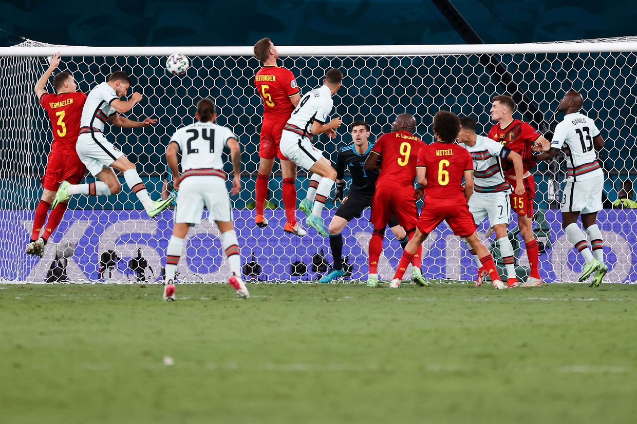 Portugal's forward Andre Silva (2L) attempts to score during the UEFA EURO 2020 round of 16 football match between Belgium and Portugal at La Cartuja Stadium in Seville on June 27, 2021. (Photo by Julio Munoz / POOL / AFP)