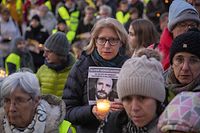 A protester holds a portrait and a candle during a demonstration to ask for the release of Belgian aid worker Olivier Vandecasteele, who is held in Iran, on February 26, 2023 in Brussels. - Iran arrested Vandecasteele in February 2022, and he has since been held in conditions that Belgium's government has described as "inhumane". The authorities sentenced him this month to more than 12 years behind bars for "espionage" as well ordering him to be subjected to 74 lashes. (Photo by NICOLAS MAETERLINCK / Belga / AFP) / Belgium OUT