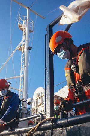 A handout picture released by German migrant rescue NGO Sea-Eye and taken on April 6, 2020, shows members of the NGO on board their vessel "Alan Kurdi" during an operation to rescue people from small boats in distress off the Libyan coast. - German NGO Sea Eye said it had saved 150 people from small boats in distress off the Libyan coast, while adding that European nations had already refused to allow rescued migrants to land. Sea Eye ship Alan Kurdi pulled 68 people from the Mediterranean in the morning before picking up dozens more later, the group said in a statement. (Photo by Cedric FETTOUCHE / sea-eye.org / AFP) / RESTRICTED TO EDITORIAL USE - MANDATORY CREDIT "AFP PHOTO /SEA-EYE.ORG / Cedric FETTOUCHE " - NO MARKETING NO ADVERTISING CAMPAIGNS - DISTRIBUTED AS A SERVICE TO CLIENTS