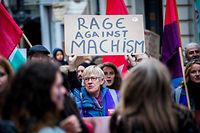 A woman holds a placard during a women's strike in the streets of Brussels, on March 8, 2019, marking the International Women's Day. (Photo by LAURIE DIEFFEMBACQ / various sources / AFP) / Belgium OUT