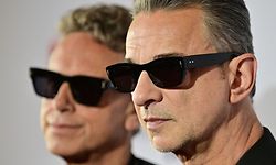 Members of the English electronic music band Depeche Mode, Martin Gore (L) and Dave Gahan, smile ahead of a press conference in Berlin, on October 4, 2022, to announce their 'Memento Mori' album and 2023 tour. (Photo by John MACDOUGALL / AFP)