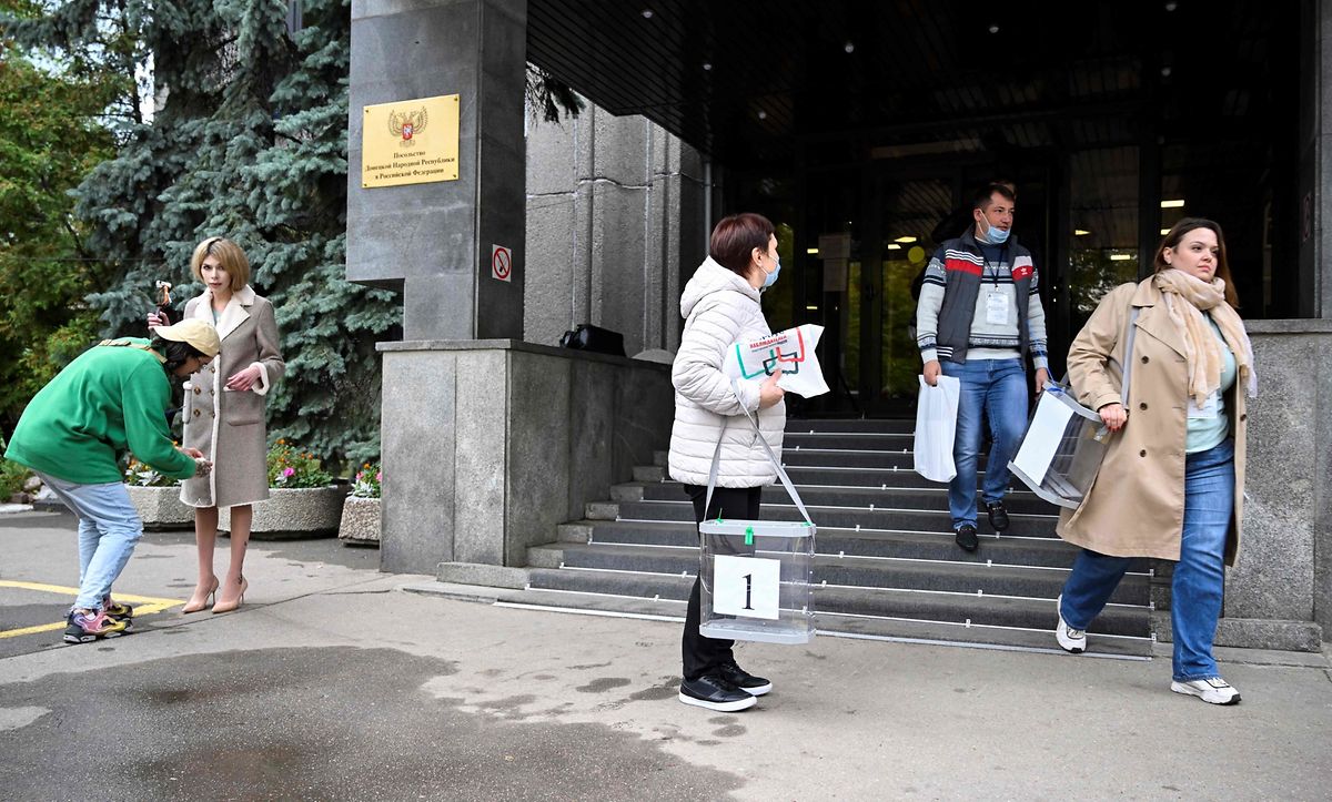 Election commission members with mobile ballot boxes leave the embassy of the self-proclaimed Donetsk People's Republic (DNR), the eastern Ukrainian breakaway region, in Moscow on Friday