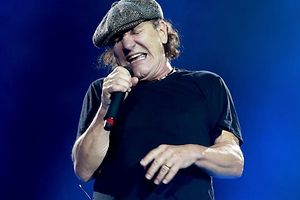 (FILES) This file photo taken on September 27, 2015 shows singer Brian Johnson of AC/DC performs at Dodger Stadium in Los Angeles. Australian rock elders AC/DC on Monday postponed remaining dates on their US tour after singer Brian Johnson was warned he risked total deafness. The 68-year-old Johnson "has been advised by doctors to stop touring immediately or risk total hearing loss," the band said in a statement. / AFP / GETTY IMAGES NORTH AMERICA / KEVIN WINTER