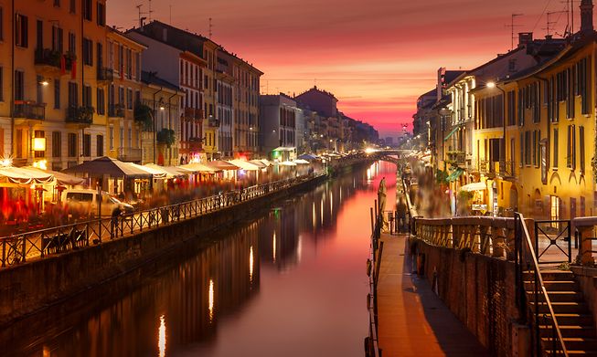 Milan's Naviglio Grande is home to multiple canal-side bars and cafes, perfect for watching the sunset