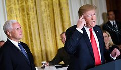 US Vice President Mike Pence listens while US President Donald Trump speaks during the National Space Council meeting in the East Room of the White House on June 18, 2018 in Washington,DC. / AFP PHOTO / Brendan Smialowski