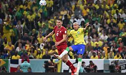 Serbia's defender #04 Nikola Milenkovic and Brazil's forward #09 Richarlison jump for the ball during the Qatar 2022 World Cup Group G football match between Brazil and Serbia at the Lusail Stadium in Lusail, north of Doha on November 24, 2022. (Photo by Anne-Christine POUJOULAT / AFP)