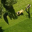 male gardener working with lawn mower