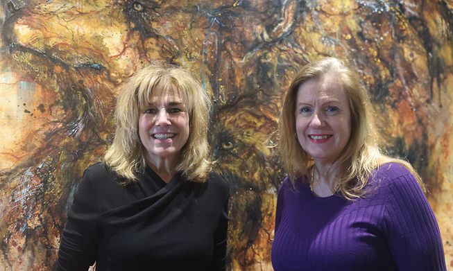Christine Kieffer (left) and Stefanie Zutter founders of Artscape, in front of artist Matthieu Gauthier's piece "bear soul" on display at  Bistrot du Sommelier 