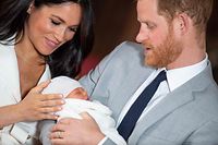 Britain's Prince Harry, Duke of Sussex (R), and his wife Meghan, Duchess of Sussex, pose for a photo with their newborn baby son in St George's Hall at Windsor Castle in Windsor, west of London on May 8, 2019. (Photo by Dominic Lipinski / POOL / AFP)