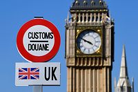 A model of a customs road sign is seen at the mock border of the United Kingdom and the European Union, with a model of Big Ben in the background, during the reopening of the 'Mini-Europe' theme park of small-scale models of European capitals and their landmarks, in Brussels on May 20, 2020. (Photo by JOHN THYS / AFP)