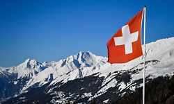 A Swiss flag flutters on March 4, 2018 in Crans-Montana above the Rhone valley in the Swiss canton of Valais, location of Sion, a city of some 34,000 souls bidding to host the 2026 Winter Olympic Games.
The official race to succeed 2018 hosts Pyeongchang, and Beijing in 2022 begins in March when would be candidates file "letters of intention" to the International Olympic Committee. / AFP PHOTO / Fabrice COFFRINI