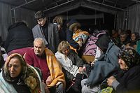 EDITORS NOTE: Graphic content / TOPSHOT - Earthquake survivors sit sheltering in a tent in Hatay, the day after a 7.8-magnitude earthquake struck the country's southeast on February 7, 2023. - Rescuers in Turkey and Syria braved frigid weather, aftershocks and collapsing buildings, as they dug for survivors buried by an earthquake that killed more than 5,000 people. Up to 23 million people could be affected by the massive earthquake that has killed thousands in Turkey and Syria, the WHO warned on Tuesday, promising long-term assistance. (Photo by BULENT KILIC / AFP)