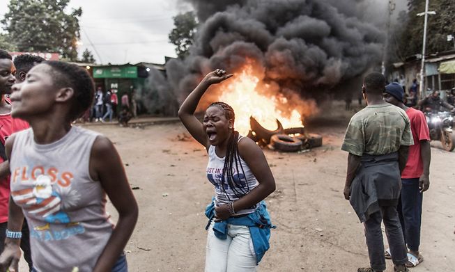 Supporters of Azimio La Umoja Party presidential candidate Raila Odinga demonstrate with burning tyres in Kibera, Nairobi, after William Ruto was announced as Kenya's president-elect