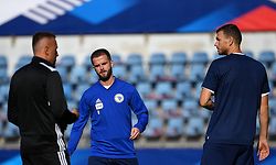 (from L) Bosnia-Herzegovina's Bulgarian head-coach Ivaylo Bogdanov Petev, Bosnia-Herzegovina's midfielder Miralem Pjanic and Bosnia-Herzegovina's forward Edin Dzeko speak together as they take part in a training session at the Meineau stadium in Strasbourg, on August 31, 2021 on the eve of the FIFA World Cup Qatar 2022 qualification Group D football match between France and Bosnia-Herzegovina. (Photo by FRANCK FIFE / AFP)