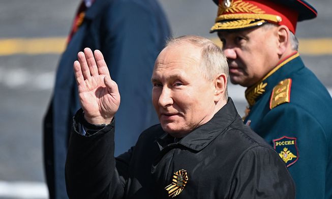 Russian President Vladimir Putin and Defence Minister Sergei Shoigu leave Red Square after the Victory Day military parade in central Moscow on May 9, 2022.