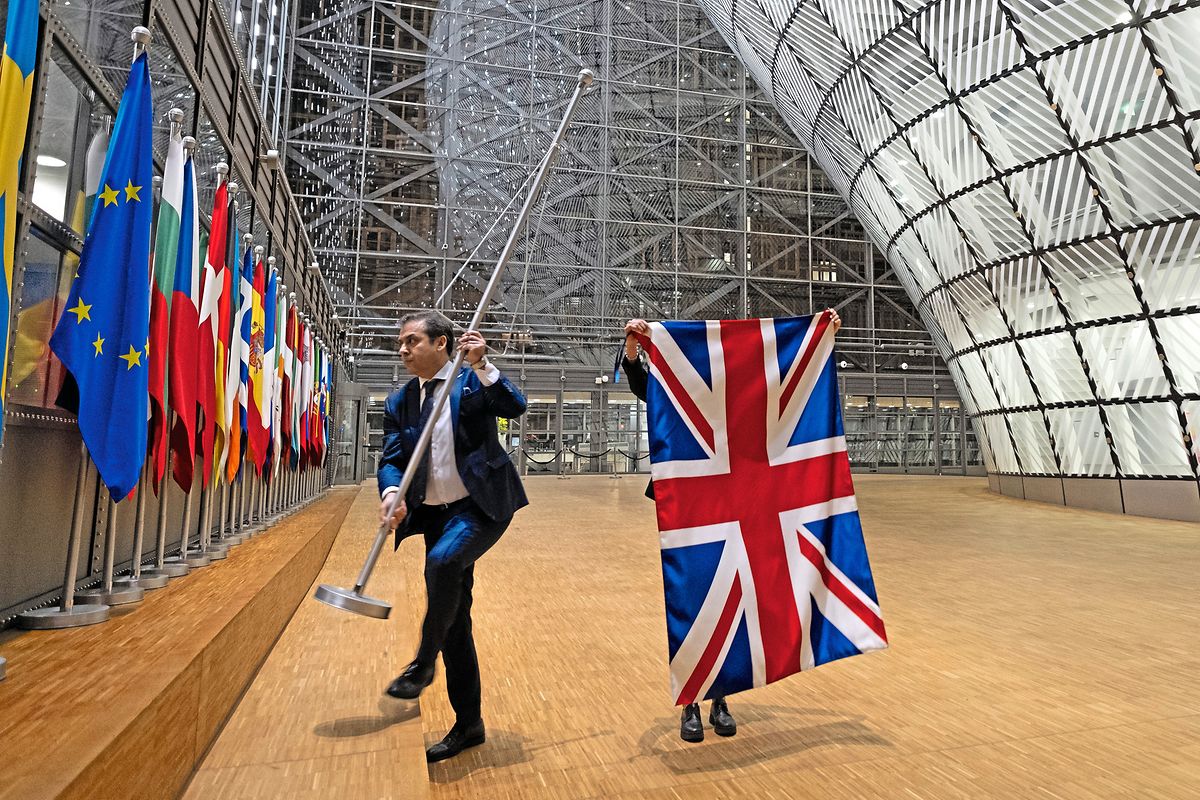 EU Council staff members remove the United Kingdom's flag from the European Council building on Brexit Day, Brussels, Belgium, 31st January, 2020.