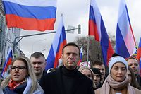 (FILES) In this file photo taken on February 29, 2020 Russian opposition leader Alexei Navalny, his wife Yulia, opposition politician Lyubov Sobol and other demonstrators take part in a march in memory of murdered Kremlin critic Boris Nemtsov in downtown Moscow. - US President Donald Trump said on September 4, 2020 that he had not seen proof yet that Russian opposition leader Alexei Navalny had been poisoned. (Photo by Kirill KUDRYAVTSEV / AFP)