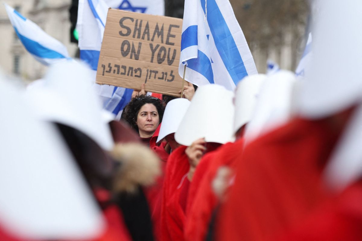 Protesters supporting women's rights, dressed as characters from The Handmaid's Tale protest against controversial legal reforms being touted by the Israel's hard-right government, 24 March 24 2023