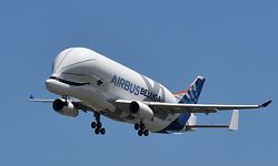 (FILES) In this file photo taken on July 19, 2018, an Airbus 'BelugaXL' aircraft comes into land at Toulouse-Blagnac, after its maiden test flight of some four hours. - The first BelugaXL, an oversized cargo aircraft designed to transport aircraft parts between Airbus production sites, has entered into service, the European aircraft manufacturer announced on January 13, 2020. The aircraft, whose hump above the cockpit resembles that of a cetacean, offers a transport capacity 30% higher than that of its predecessor, the BelugaST. It will make it possible to "support the ongoing ramp-up of production of civil aircraft programmes", Airbus explained in a press release. (Photo by ERIC CABANIS / AFP)