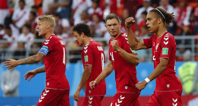 Denmark's forward Yussuf Poulsen (R) celebrates with teammates after scoring a goal during the Russia 2018 World Cup Group C football match between Peru and Denmark at the Mordovia Arena in Saransk on June 16, 2018.  / AFP PHOTO / Jack GUEZ / RESTRICTED TO EDITORIAL USE - NO MOBILE PUSH ALERTS/DOWNLOADS