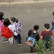 NEW YORK, NEW YORK - SEPTEMBER 27: Students line up in the morning at Yung Wing School P.S. 124 on September 27, 2021 in New York City. New York City schools fully reopened earlier this month with all in-person classrooms and mandatory masks on students. The city's mandate ordering all New York City school staff to be vaccinated by midnight today was delayed again after a federal appeals court issued a temporary injunction three days before the mayor's deadline.   Michael Loccisano/Getty Images/AFP
== FOR NEWSPAPERS, INTERNET, TELCOS & TELEVISION USE ONLY ==