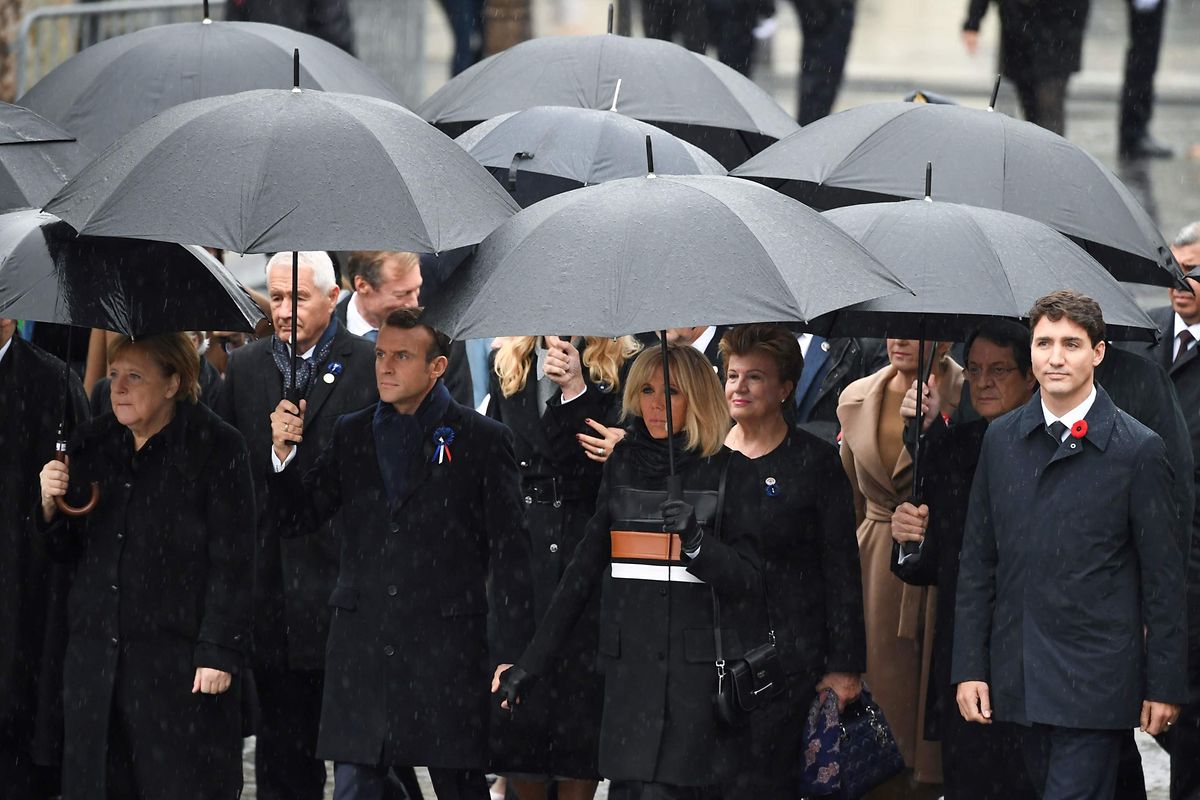 (From L) German Chancellor Angela Merkel, French President Emmanuel Macron and his wife Brigitte Macron and Canadian Prime Minister Justin Trudeau arrive to attend a ceremony at the Arc de Triomphe in Paris on November 11, 2018 as part of commemorations marking the 100th anniversary of the 11 November 1918 armistice, ending World War I. (Photo by Eric FEFERBERG / AFP)