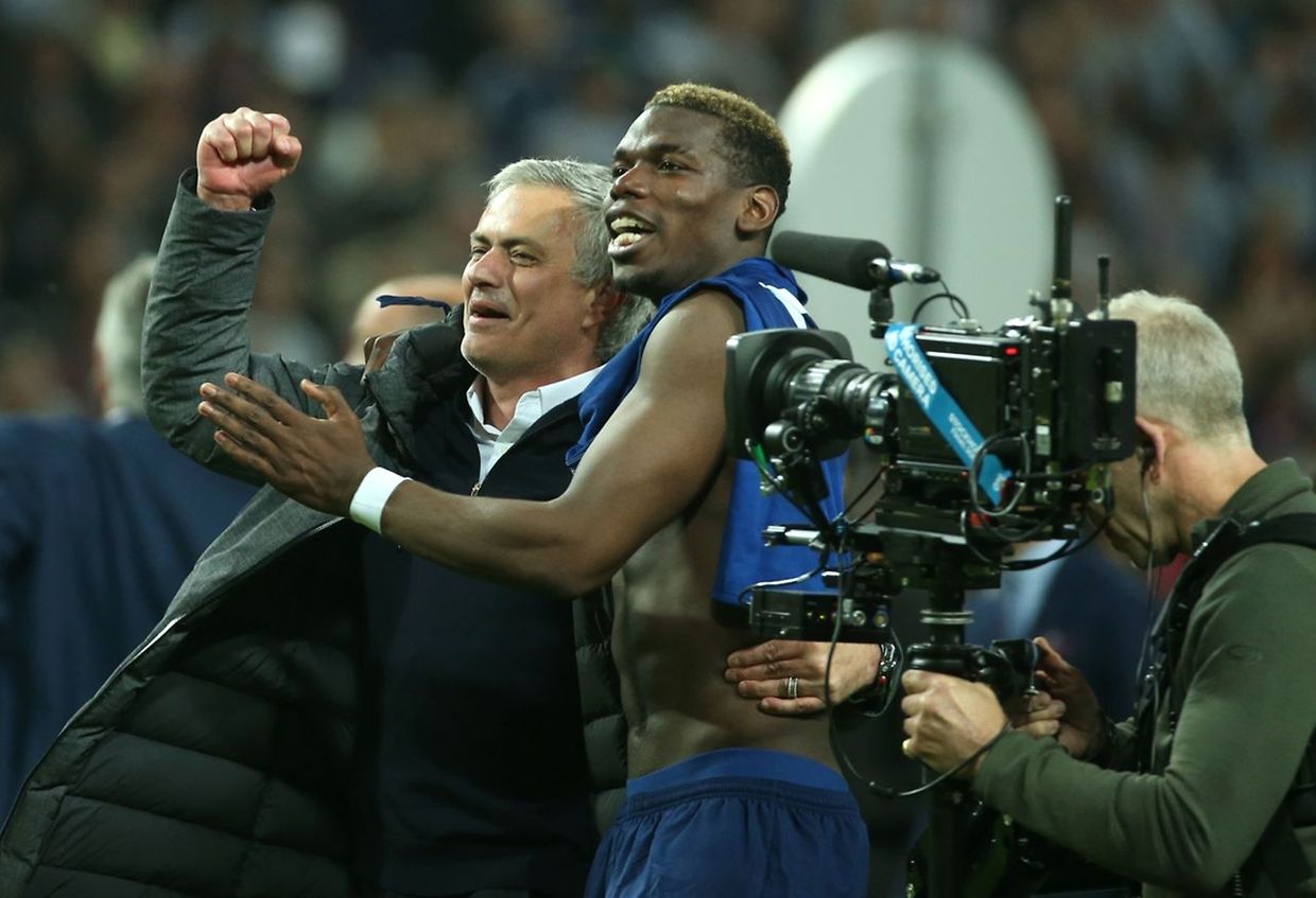 Manchester United's Portuguese manager Jose Mourinho (L) and Manchester United's French midfielder Paul Pogba celebrate after their team won the UEFA Europa League final football match Ajax Amsterdam v Manchester United on May 24, 2017 at the Friends Arena in Solna outside Stockholm. / AFP PHOTO / Soren Andersson