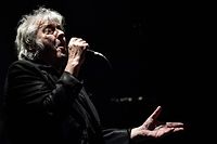 (FILES) In this file photo taken on February 11, 2020 Belgian singer Arno performs on stage at the Trianon theatre in Paris. - Belgian singer Arno died at the age of 72, his agent announced on April 23, 2022. (Photo by Christophe ARCHAMBAULT / AFP)