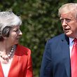 US President Donald Trump (R) and Britain's Prime Minister Theresa May (L) walk together after holding a meeting at Chequers, the prime minister's country residence, near Ellesborough, northwest of London on July 13, 2018 on the second day of Trump's UK visit.
US President Donald Trump launched an extraordinary attack on Prime Minister Theresa May's Brexit strategy, plunging the transatlantic "special relationship" to a new low as they prepared to meet Friday on the second day of his tumultuous trip to Britain. / AFP PHOTO / POOL / Jack Taylor