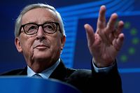 European Commission President Jean-Claude Juncker gestures during his last presser in Brussels on November 29, 2019. - The 64-year-old head of the EU's executive is at the end of his five-year mandate and is expected to hand over the reins to his successor on December 1, 2019. (Photo by Kenzo TRIBOUILLARD / AFP)