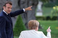 German Chancellor Angela Merkel meets with French President Emmanuel Macron before Germany takes over European Union's presidency on June 29, 2020 at the German governmental guest house in Meseberg, outside Berlin. (Photo by Hayoung JEON / POOL / AFP)