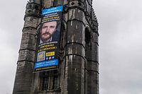 This photograph taken in Tournai on January 12, 2023 shows a giant banner with a portrait of Belgian aid worker Olivier Vandecasteele who was arrested by the Iranian authorities on February 24, 2022. - Iran has sentenced Belgian aid worker Olivier Vandecasteele to more than 12 years behind bars for "espionage" as well ordering him to be subjected to 74 lashes, the judiciary said on January 10, 2023. Vandecasteele, 41, was handed multiple sentences totalling 40 years on a range of charges, but with the sentences to run concurrently he will serve 12 and a half years in jail, the judiciary's Mizan Online website reported. (Photo by Justin Namur / BELGA / AFP) / Belgium OUT