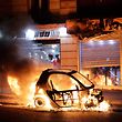 TOPSHOT - A car burns during a protest of "yellow vests" (gilets jaunes) against rising costs of living near Paris city Hall on December 8, 2018. - Paris was on high alert on December 8 with major security measures in place ahead of fresh "yellow vest" protests which authorities fear could turn violent for a second weekend in a row. (Photo by Thomas SAMSON / AFP)