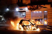 TOPSHOT - A car burns during a protest of "yellow vests" (gilets jaunes) against rising costs of living near Paris city Hall on December 8, 2018. - Paris was on high alert on December 8 with major security measures in place ahead of fresh "yellow vest" protests which authorities fear could turn violent for a second weekend in a row. (Photo by Thomas SAMSON / AFP)