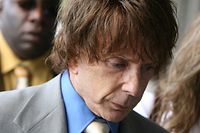 (FILES) In this file photo music producer Phil Spector arrives for his murder trial at the Los Angeles Superior Court in Los Angeles on September 20, 2007. - Phil Spector, who revolutionized 1960s pop music but ended up in prison for murder, has died, authorities said on January 17, 2021. Spector was pronounced dead on Saturday and his "official cause of death will be determined by the medical examiner," according to a statement from the California Department of Corrections and Rehabilitation. (Photo by Gabriel BOUYS / AFP)