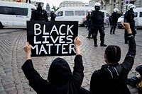 Protesters demonstrate during an anti-racism protest, in Brussels, on June 7, 2020, as part of a weekend of 'Black Lives Matter' worldwide protests against racism and police brutality in the wake of the death of George Floyd, an unarmed black man killed while apprehended by police in Minneapolis, US. (Photo by Kenzo TRIBOUILLARD / AFP)