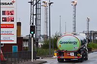 A tanker drives by Essar Oil's Stanlow refinery in Ellesmere port, northwest England on September 27, 2021. - Britain experienced further 'panic-buying' of motor fuel today as a shortage of lorry drivers on Covid and Brexit fallout could reportedly prompt the government to use the army to make deliveries. (Photo by Paul ELLIS / AFP)