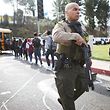 SANTA CLARITA, CALIFORNIA - NOVEMBER 14: Students are evacuated from Saugus High School onto a school bus after a shooting at the school left two students dead and three wounded on November 14, 2019 in Santa Clarita, California. A suspect in the shooting is being treated at a local hospital for a gunshot wound to the head.   Mario Tama/Getty Images/AFP
== FOR NEWSPAPERS, INTERNET, TELCOS & TELEVISION USE ONLY ==