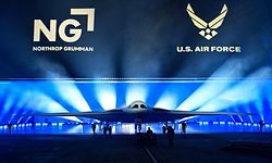 The B-21 Raider is unveiled during a ceremony at Northrop Grumman's Air Force Plant 42 in Palmdale, California, December 2, 2022. - The high-tech stealth bomber can carry nuclear and conventional weapons and is designed to be able to fly without a crew on board. The B-21 -- which is on track to cost nearly $700 million per plane and is the first new US bomber in decades -- will gradually replace the B-1 and B-2 aircraft, which first flew during the Cold War. (Photo by Frederic J. BROWN / AFP)