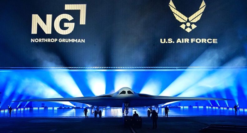 The B-21 Raider is unveiled during a ceremony at Northrop Grumman's Air Force Plant 42 in Palmdale, California, December 2, 2022. - The high-tech stealth bomber can carry nuclear and conventional weapons and is designed to be able to fly without a crew on board. The B-21 -- which is on track to cost nearly $700 million per plane and is the first new US bomber in decades -- will gradually replace the B-1 and B-2 aircraft, which first flew during the Cold War. (Photo by Frederic J. BROWN / AFP)
